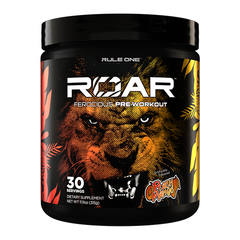 A black container of Rule One R1 Roar Ferocious Pre-Workout, peach mango flavor, shows a fierce lion face and orange-yellow leaves on the label. It contains 30 servings to support workout intensity.